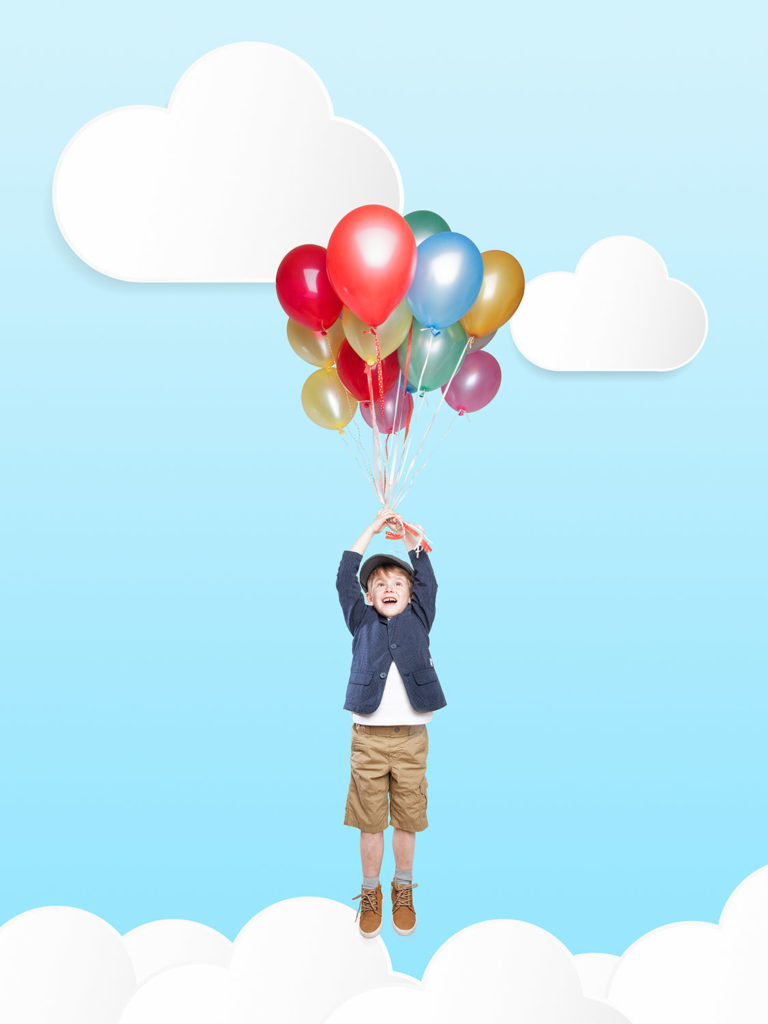 Cute Boy flying in the Clouds